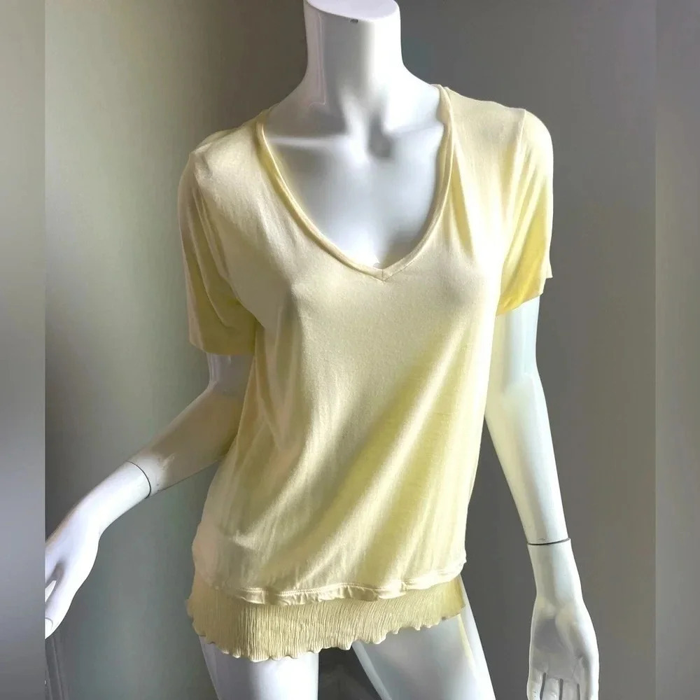 Vince light yellow v-neck feminine t shirt with added ruffle on bottom Size S